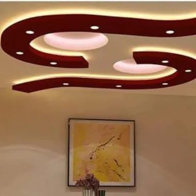 A flowing, S-shaped design in a bold red color. This type of organic, curved POP work can make a large hall or living room feel very dynamic.