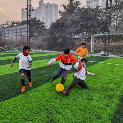 The heart of the game. A fierce but fair battle for possession between our young players during a practice match. This is where they learn resilience and teamwork.