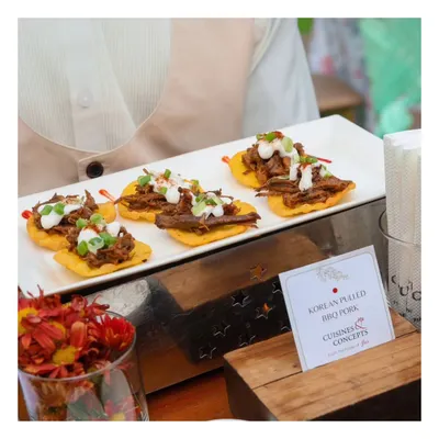 An elegant platter of Korean Pulled BBQ Pork served on crisp tortilla chips and topped with a cooling crema. This appetizer is a perfect example of our global fusion approach, combining bold international flavours in a single bite.