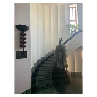 The staircase in my grandmother's childhood home in Calcutta, built in the early 1940s. The graceful curve of the marble stairs, the simple elegance of the wall sconce, and the play of light and shadow are details that remain timeless and inspiring.