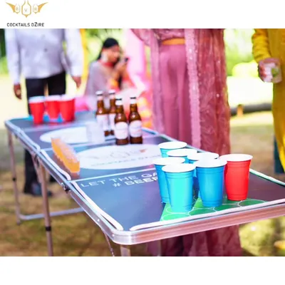 A classic game of Beer Pong set up for a daytime event. We provide the custom table, cups, and beer to get the competition started.