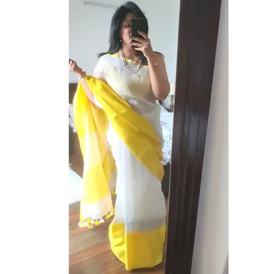 A quick mirror selfie to check my white and yellow linen saree before leaving for lunch. This helps me see the overall drape and how the colours look together.