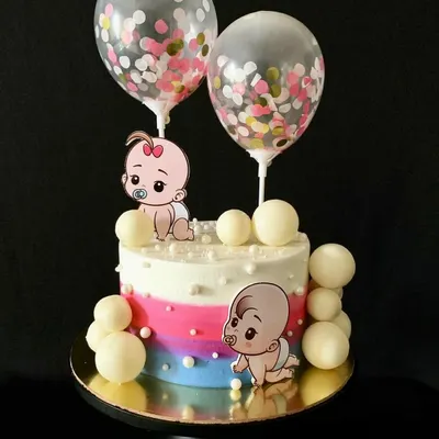 This gender reveal cake with cute baby toppers and confetti balloons is perfect for the big announcement.