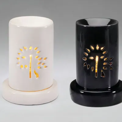 Our electric ceramic diffusers are available in both classic white and sleek black. Both versions feature a beautiful tree-of-life cutout design that glows warmly when the diffuser is on, adding an elegant touch to your home decor.