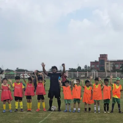Another one of our talented youth teams, hands up and full of energy before their league match. The excitement and camaraderie are contagious.
