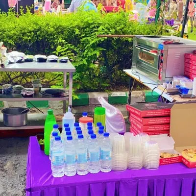 This was my live food setup for a Saturday night event at Carlton Estates. You can see the pizza oven, prep station, and serving area, all organized for efficient service in an outdoor park setting.