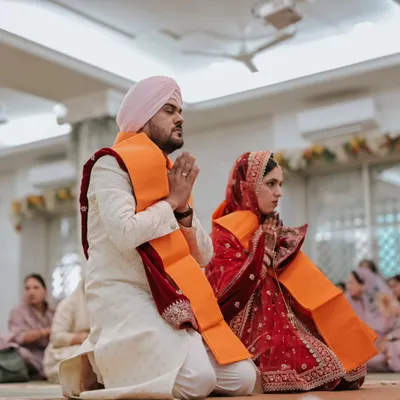 A moment of quiet devotion during a Sikh Anand Karaj ceremony. I focus on capturing the spiritual significance and serene beauty of such sacred rituals.