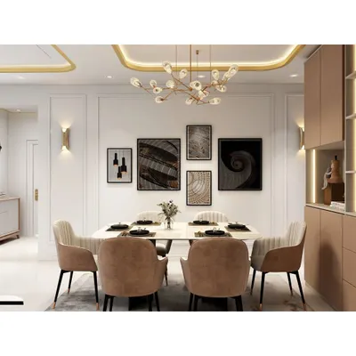 A sophisticated dining area featuring a white marble-top table, plush upholstered chairs, and a modern gallery wall. The cove lighting and statement chandelier add a layer of luxury.