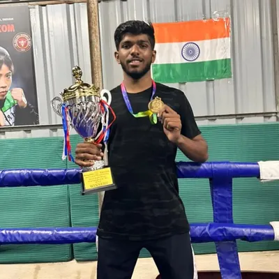 Proud moment for our gym. One of my top boxers with his trophy and gold medal from the Bengaluru University Inter-college Boxing Championship.