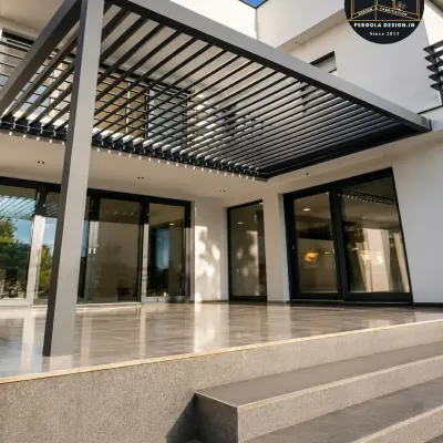 This sleek, louvered aluminum pergola extends the living space of this modern home, creating a seamless indoor-outdoor transition. The adjustable louvers offer control over sunlight and airflow, making the patio usable in any weather.