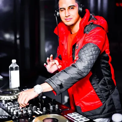 The energy during a live set is everything. My custom-produced tracks are designed to create these peak moments, mixing familiar Bollywood vocals with unexpected drops and beats.