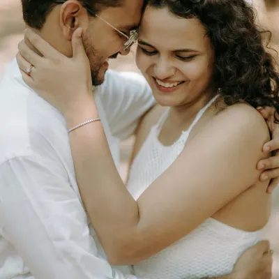 A close-up portrait filled with genuine smiles and affection. These are the unposed, heartfelt moments I strive to capture.
