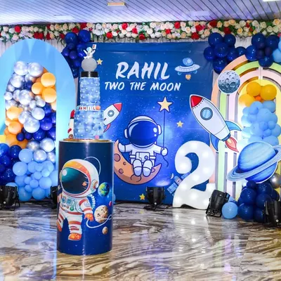 An amazing "Two the Moon" space-themed birthday decoration for a second birthday party. I capture the entire setup to remember your creative party theme.