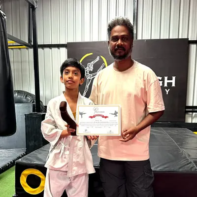 I am incredibly proud to present this student with his new belt and certificate after a successful Karate Belt Grading Exam. His hard work and dedication have paid off. Congratulations.