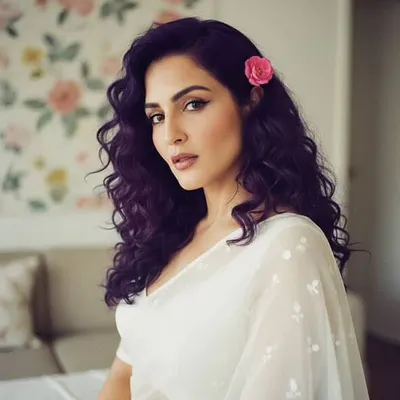 A soft and romantic look featuring purple-toned hair and a delicate pink flower. The makeup was kept minimal and fresh, with a defined winged liner and a natural lip tint to complement the overall gentle and dreamy vibe of the shoot.