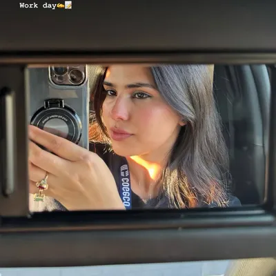 A car mirror selfie from a workday, the first slide of my June photo dump.