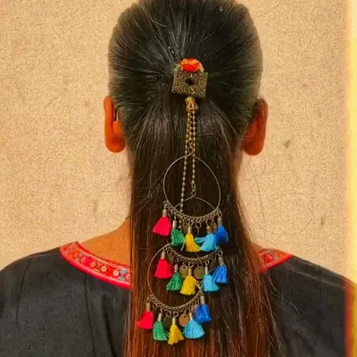Beyond bags, I also love creating other unique accessories. This is a handcrafted hair accessory with colorful tassels, designed to add a fun, bohemian flair to a simple ponytail or braid for a festive occasion.