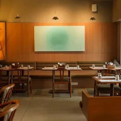 One of my "Lime & Soda" paintings installed at Sidewalk cafe in Agra. The soft green aura of the artwork adds a calming, organic feel to the warm, wood-toned interior of the restaurant.