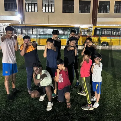 Our young fighters from the Boxing Summer Camp posing in their boxing stance. We focus on making fitness fun while teaching valuable self-defense skills.