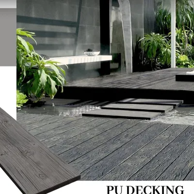 This poolside area features my dark grey PU decking. The material is slip-resistant and waterproof, making it a safe and stylish choice for areas around water. The stepping stones appear to float over the deck.