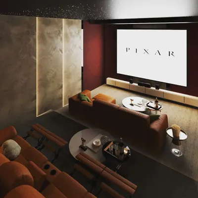 Cozy evenings are best spent in a home theater like this. I designed this space with two-tiered seating, including plush recliners and a comfortable sofa, ensuring everyone has the best seat in the house for movie night.