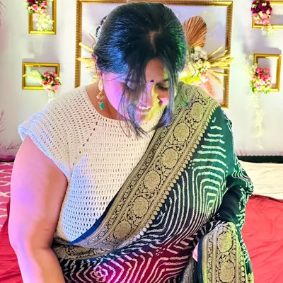 This photo shows my mom looking radiant in a custom crochet blouse I made for her. It's a simple, elegant design that pairs beautifully with a traditional saree.