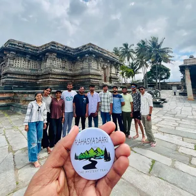 A group posing with my signature badge in front of the stunning Chennakesava Temple in Belur. My cultural tours explore the masterpieces of Hoysala architecture.