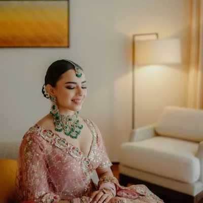 Pretty in pastels, glowing with grace. This bride looks serene and beautiful, with her makeup kept soft and luminous to match the delicate embroidery of her pink lehenga.
