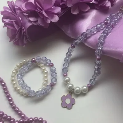 This lavender and purple jewellery set is a favourite among my younger customers, especially fans of BTS. The set, featuring a flower charm necklace and matching bracelets, is styled here with coordinating accessories.