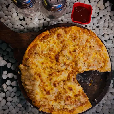My Alfredo Pizza is pure cheesy goodness on a thin crust. It arrives at your table hot and bubbling, but it never lasts long once everyone grabs a slice.