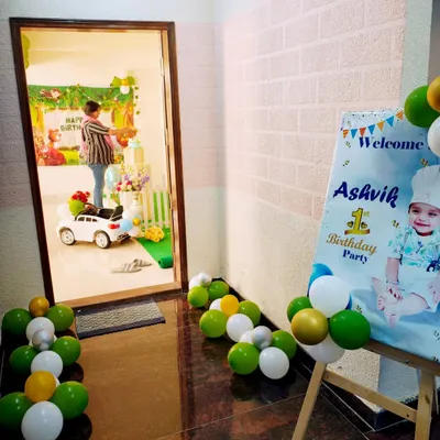 A behind-the-scenes look as I put the finishing touches on a first birthday decoration. This view from the doorway shows how I transform a home space for a celebration.