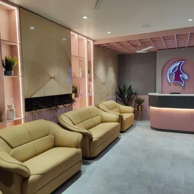 The reception and waiting area of the Life Care Clinic, where we balanced comfort and functionality. The design features soft pink tones, comfortable seating, and a branded reception desk to create a welcoming and calming first impression for patients.