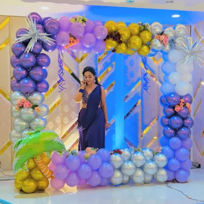 A fun selfie point I created for a party. The square frame is made of purple, silver, and gold balloons, with a blue-lit backdrop, perfect for guests to take memorable photos.