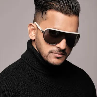 A professional headshot from a recent photoshoot. I believe in presenting a sharp and stylish image that complements the high-end corporate events I perform at.