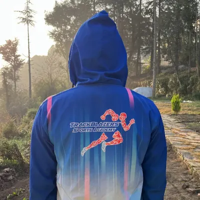 Representing Trackblazers Sports Academy against the stunning backdrop of our high-altitude training grounds. Our custom gear fosters a sense of unity and pride as our athletes push their limits together.