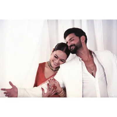 An analog film portrait of Sonakshi and Zaheer. The warmth of the film and their relaxed, happy embrace create a portrait that feels both timeless and incredibly personal.