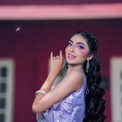 This is a full-on glam look I demonstrated for my students. It features dramatic purple-toned eye makeup and a glossy lip, paired with a sparkling lavender gown, perfect for a cocktail or reception night.