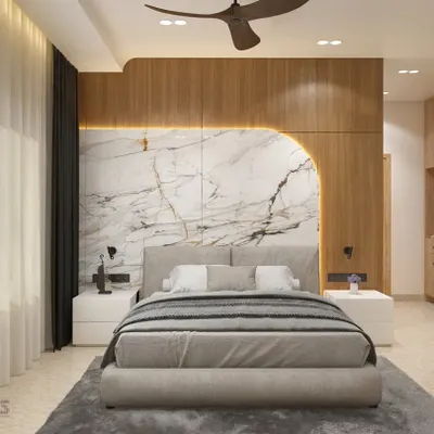 This hotel bedroom in Shimoga features a stunning headboard that combines the warmth of wood paneling with the elegance of book-matched marble. Backlighting accentuates the curved design, creating a sophisticated and inviting focal point.