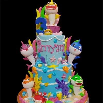 Dive into an underwater adventure with this spectacular three-tier Baby Shark cake. The entire shark family is here, surrounded by colorful coral, sea creatures, and sandy textures, making it a showstopper for a third birthday.