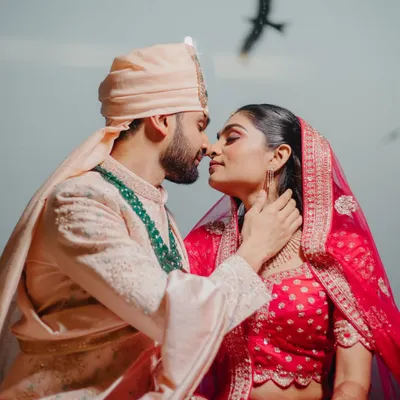 An intimate couple portrait with a bird flying overhead, adding a touch of serendipity. We look for these magical elements to make your photos unique.