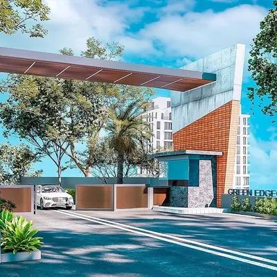 This rendering shows a proposed entrance gate for a gated community, "Green Edge Casero." The design uses a mix of materials including brick, concrete, and wood tones to create a modern yet substantial feel. The cantilevered roof provides shelter and adds a strong architectural element.