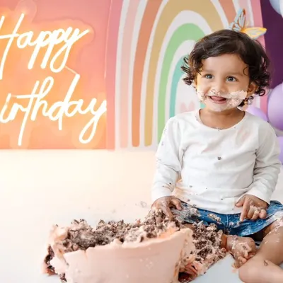 The pure joy of a first birthday cake smash! This little one is having the best time with her rainbow-themed celebration. I love capturing these messy, happy, and unforgettable moments.