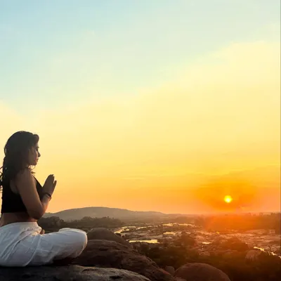 In this moment of sunrise meditation, I connect with the light outside and the Guru within. My practice is deeply tied to nature's rhythms, a source of immense gratitude and inspiration.