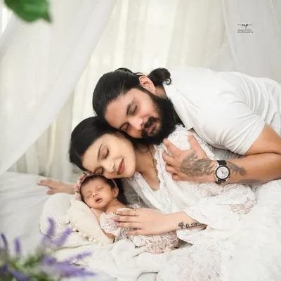 A family's quiet moment together, wrapped in soft white and pure love. These are the peaceful, candid portraits I cherish creating.