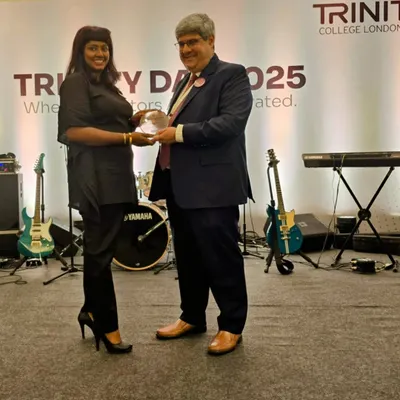 Celebrating 20 years of musical excellence. Our Principal, Mrs. Samantha D'Costa, receiving a prestigious award from Trinity College London for her incredible contribution to the performing arts in India.