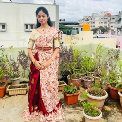 I designed this beautiful lehenga with intricate handwork on the blouse sleeves and a unique back design. The client is wearing it on her terrace garden.