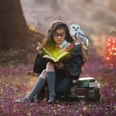 Expecto Patronum! We brought the magic of Hogwarts to life in this enchanting outdoor shoot, complete with a glowing spellbook and a wise owl.