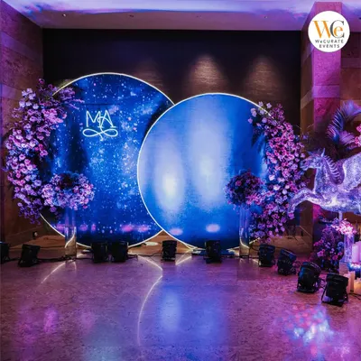 A stunning celestial-themed Sangeet I curated at the Grand Hyatt Mumbai. The deep blue backdrop with a custom monogram and starry lighting created an otherworldly atmosphere for the celebration.