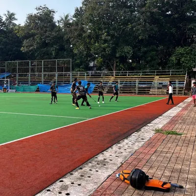 A wide shot of the action during our victorious match against Miraroad in the B.K. Mohite Memorial Hockey Tournament. Our team demonstrated excellent field coverage and strategic play.