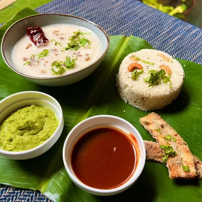 Experience the flavors of Shravan with our delicious Jeera Kaju Varai Pulao served with Dahi Kadhi. This complete meal is a perfect blend of tradition and taste, presented beautifully on a banana leaf.